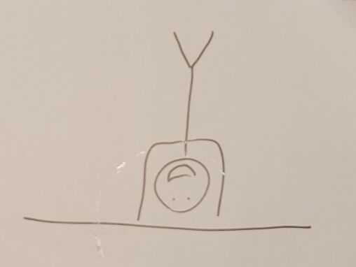 A stick figure does a handstand.