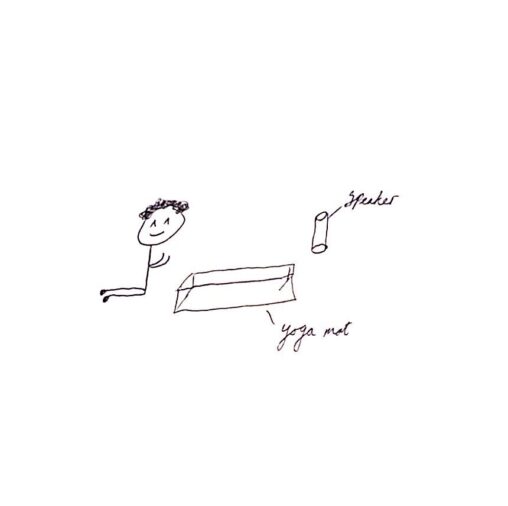 There is a yoga mat on the floor and a speaker which is playing calming relaxing music. The stick figure is preparing to do some yoga